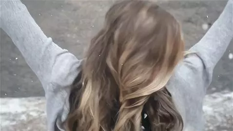 AI Video from prompt: A pretty young 25-year-old woman with a beautifu