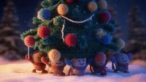 AI Video from prompt: A group of knitted yarn dolls with beaded eyes a