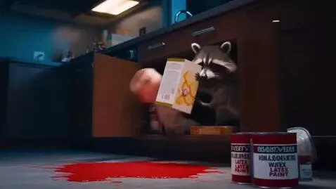 AI Video from prompt: A mischievous raccoon rummages inside an open ki