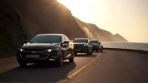 AI Video from prompt: “Transform this wedding convoy photo into a cine