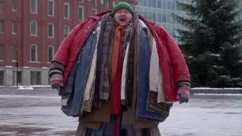 AI Video from prompt: a man is wearing the most clothes anyone has eve