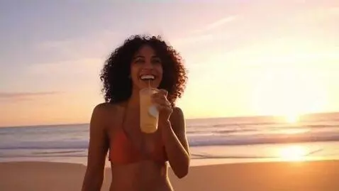 AI Video from prompt: A beautiful woman strolls in a skimpy bikini at 