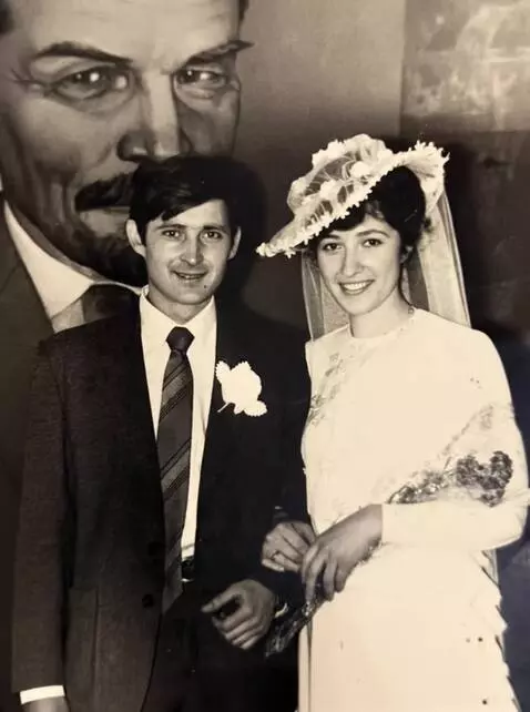 AI Video from prompt: Happy newlyweds pose for the camera, smiling and