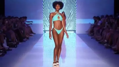 AI Video from prompt: Let there be a bikini  woman fashion show