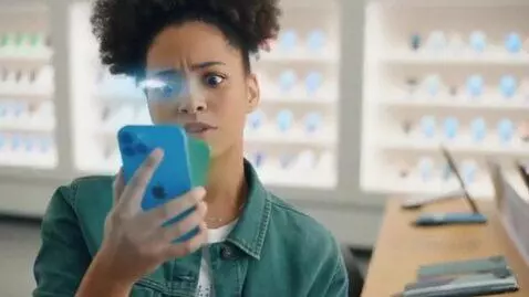 AI Video from prompt: A girl is holding an iPhone 12 and looking to bu