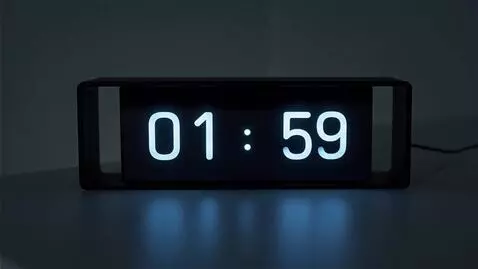 AI Video from prompt: Close-up shot of a digital clock. The time jumps