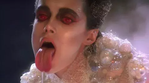 AI Video from prompt: Looking at viewer mouth wide open sticking  tong