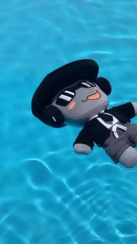 AI Video from prompt: He wearing a shorts, and swimming in pool