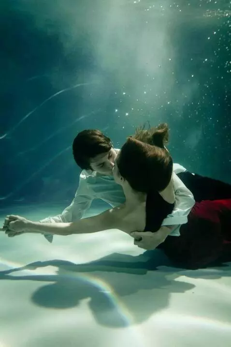 AI Video from prompt: A guy and a girl are dancing a slow dance underw