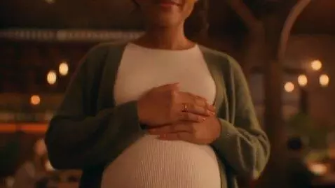 AI Video from prompt: A cinematic scene capturing a woman in a lively 