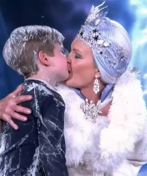 AI Video from prompt: A fifty-year-old snow queen kisses a young man o