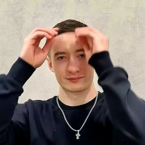 AI Video from prompt: This man takes the hair off his head and it turn