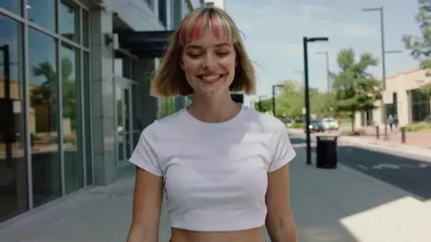 AI Video from prompt: A blond woman with a short bob (20s, pink bang) 