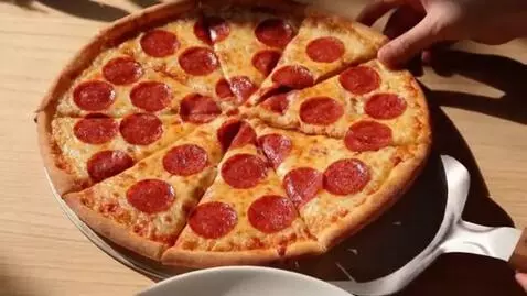 AI Video from prompt: Scene: Pizza with Pepperoni  Camera: Top-down vi