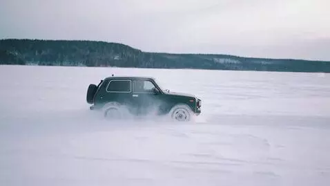 AI Video from prompt: Niva rides through a snow field in Slow Mo
