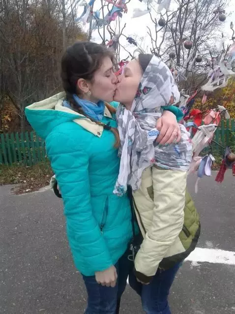 AI Video from prompt: the girls kiss each other on the lips and hug ea