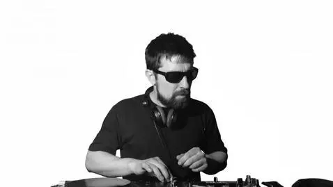 AI Video from prompt: The DJ mixes the music vigorously. Add only the 