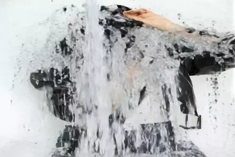 AI Video from prompt: her clothes dissolve in the rain