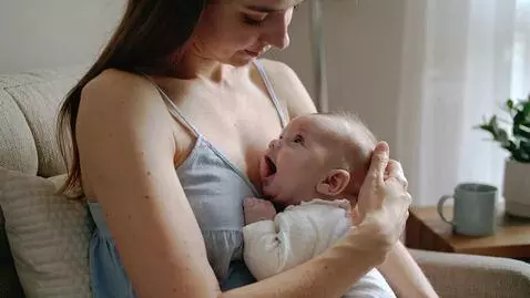 AI Video from prompt: Breastfeeding mom for baby