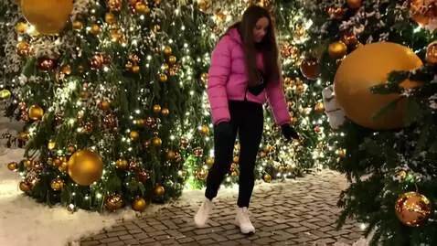 AI Video from prompt: The girl approaches the New Year's ball on the r