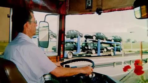 AI Video from prompt: The driver drives the bus along the road