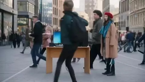 AI Video from prompt: A busy city center in broad daylight. In the mid