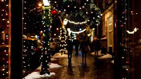 AI Video from prompt: Outside the window, evening is falling, snow is 