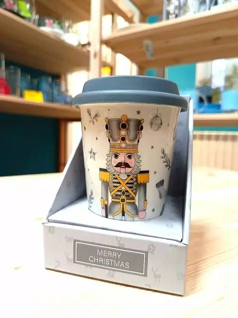 AI Video from prompt: The man on the cap winks and waves his hand