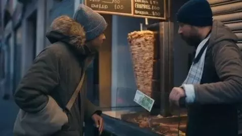 AI Video from prompt: man trying to buy souvlaki  but never can