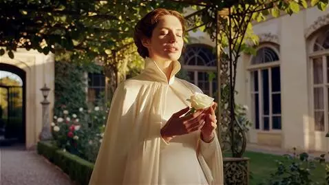 AI Video from prompt: A noblewoman of timeless elegance, standing in t