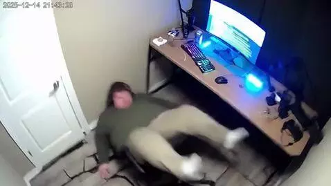 AI Video from prompt: The scene is filmed from a ceiling mounted CCTV 