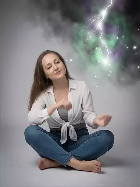 AI Video from prompt: The girl lowers her right hand and rests it rela