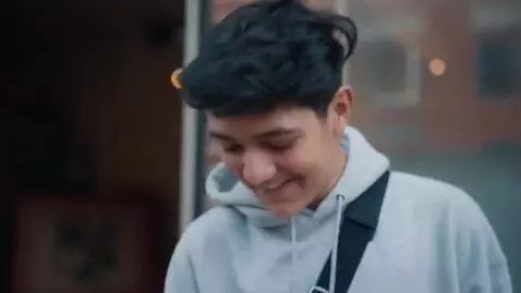 AI Video from prompt: the kids on the street are standing with signs a