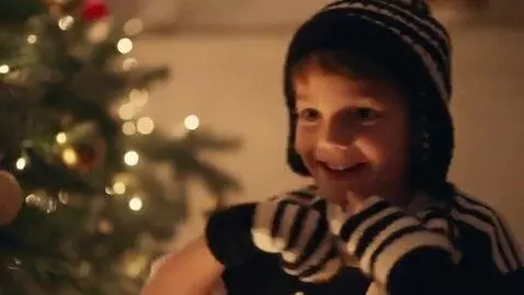 AI Video from prompt: A little boy in a black and white soccer uniform