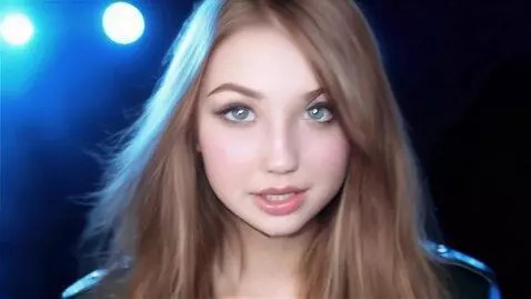 AI Video from prompt: A pretty 25-year-old young adult woman with a be