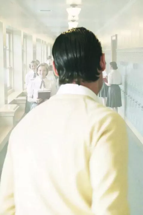 AI Video from prompt: have the model in image1 walking through a busy 