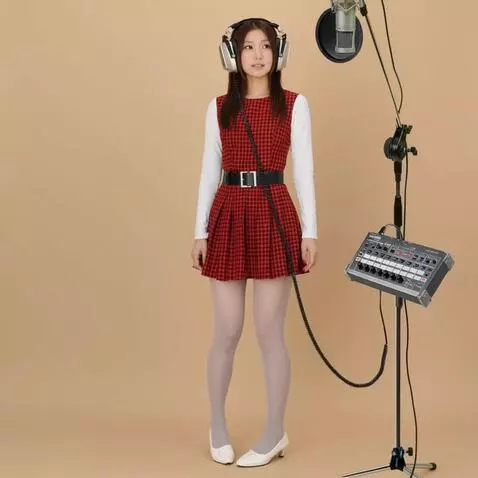 AI Video from prompt: The woman turns to the microphone