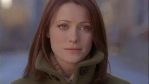 AI Video from prompt: Extreme close-up, same woman. A fleeting, though