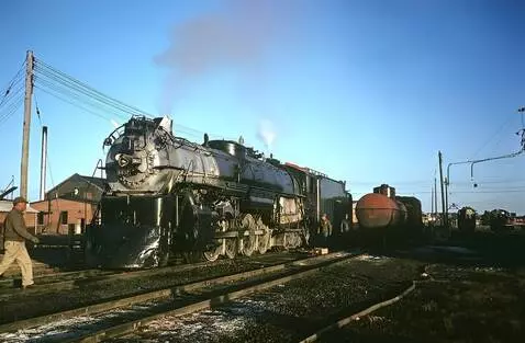 AI Video from prompt: Steam Locomotive getting services from the crew 