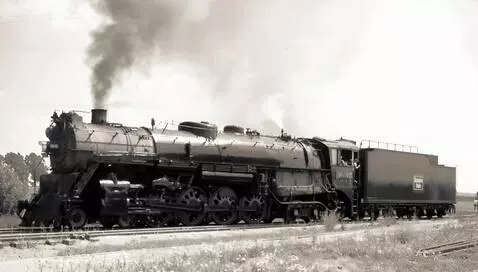 AI Video from prompt: Steam Locomotive backing up to join up its train