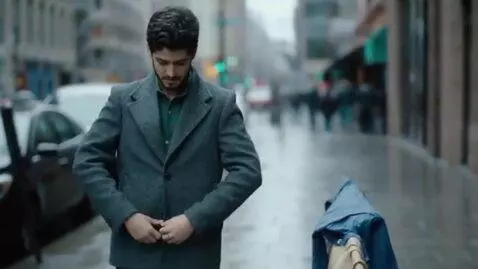 AI Video from prompt: A young man in a jacket (unbuttoned not so much 