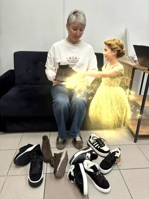 AI Video from prompt: A woman in a black evening dress sits sadly on a