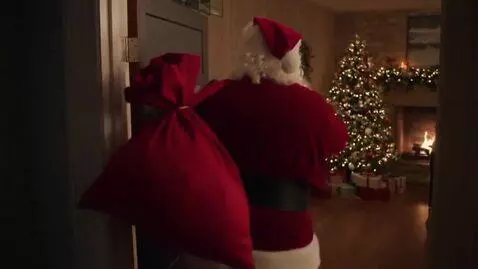 AI Video from prompt: santa claus comes into a room, decorated for x-m