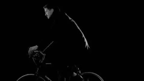 AI Video from prompt: A black and white cinematic scene of a man ridin
