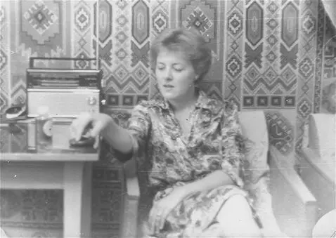 AI Video from prompt: The girl turns on the tape recorder standing on 