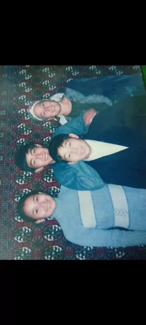 AI Video from prompt: They look at the camera and smile, wave their ha