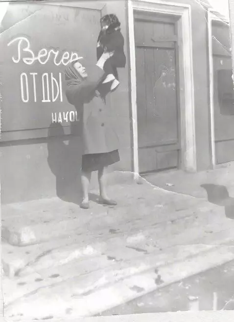 AI Video from prompt: The woman throws the child up and catches it, th