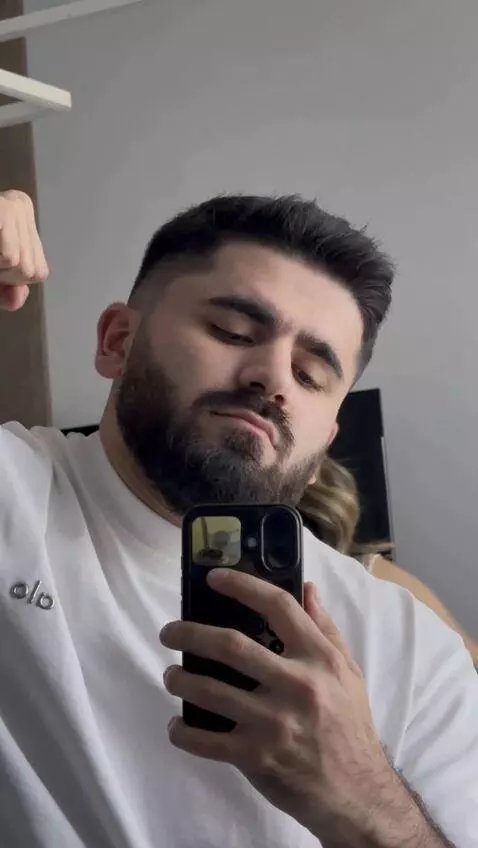 AI Video from prompt: A guy is standing in front of a mirror, and a be