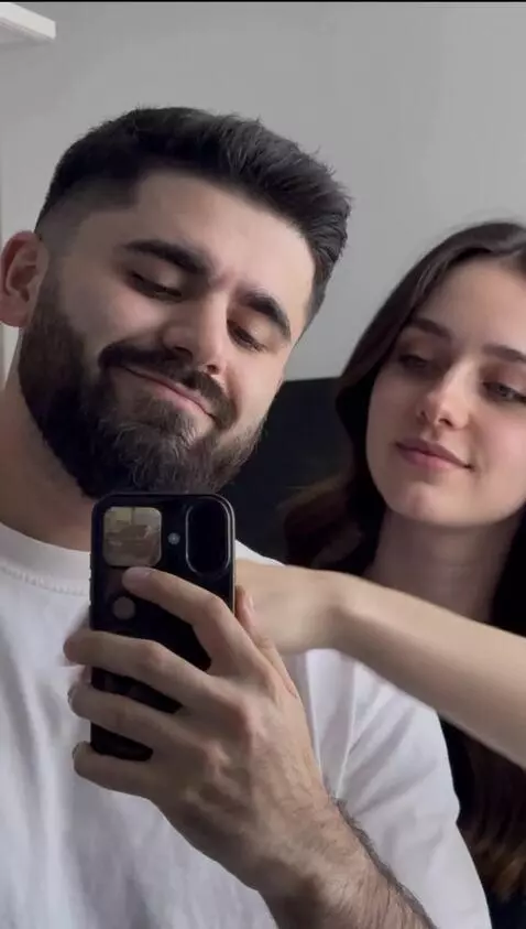 AI Video from prompt: A guy is standing in front of a mirror, and a be