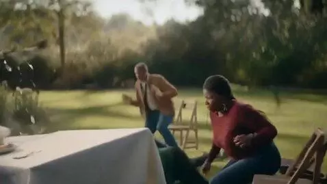 AI Video from prompt: a tiger kicks off a table of food with people ha